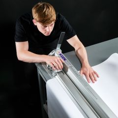 Flip stops on both sides of the cutter provide horizontal clamping and allow for bi-directional cutting for left- and right-handed operators.
